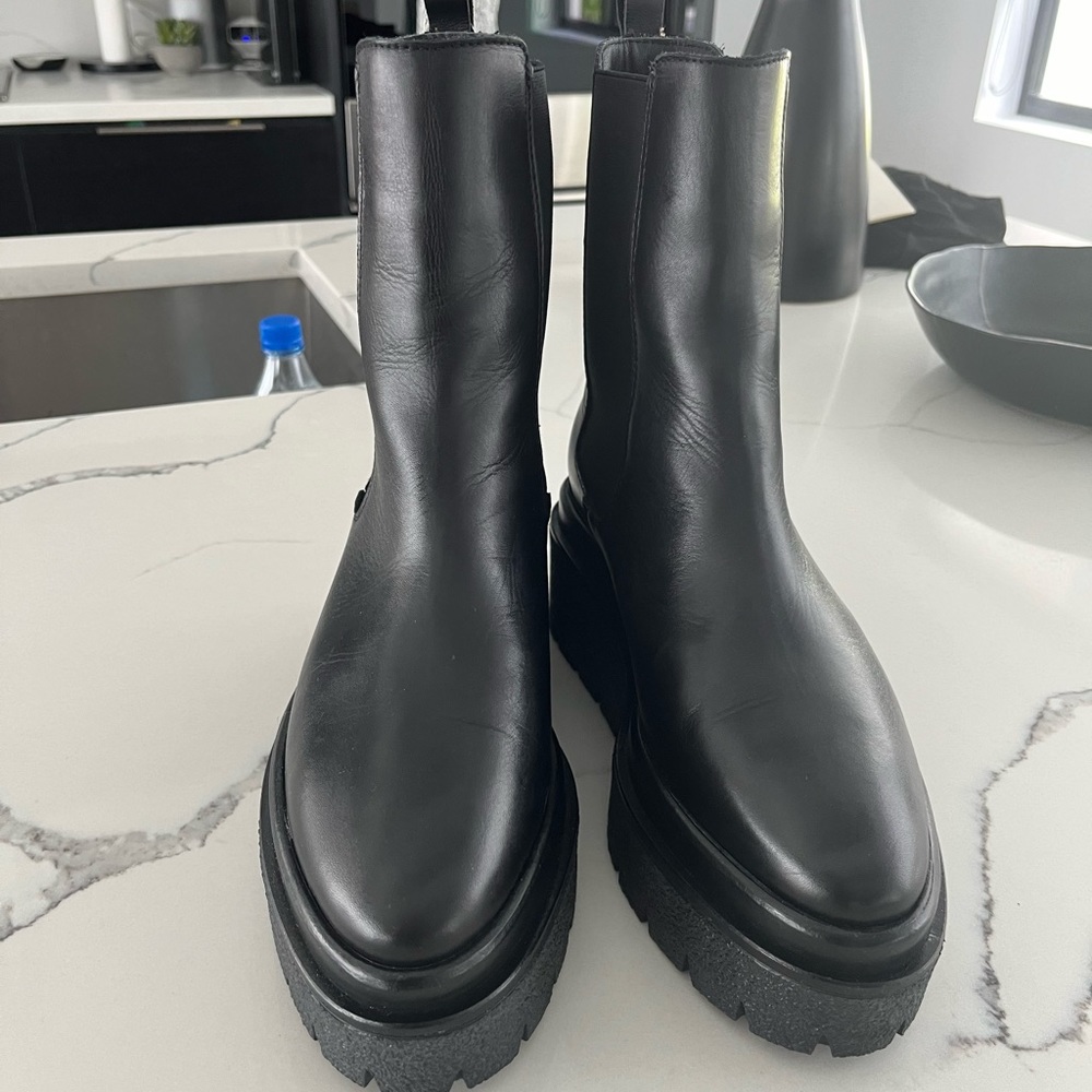 Leather wedge pull on boot. 2 inch rubber platform. Brand new!
